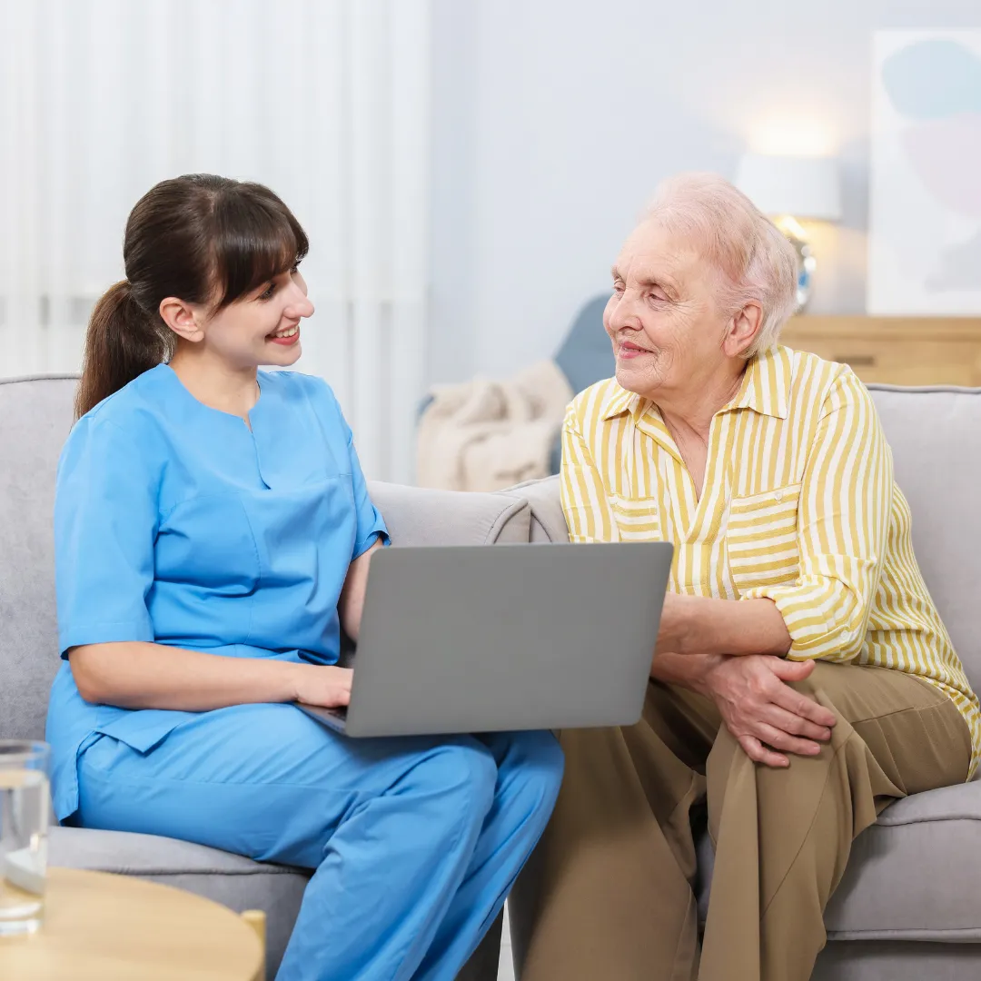 Home caregiver discussing daily care needs with an older woman in Columbus, OH.