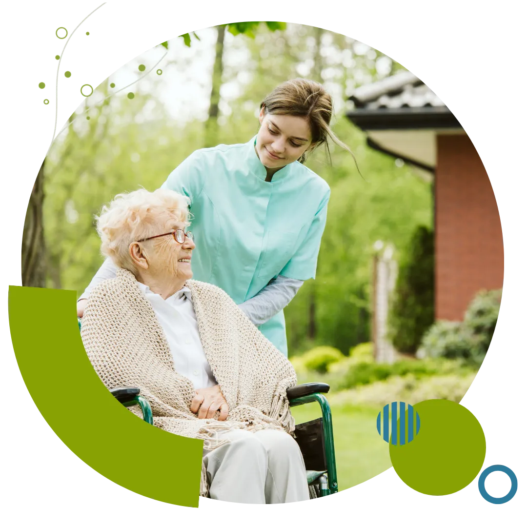 Dedicated caregiver assisting an older woman using a wheelchair with supportive home care services in Columbus, OH.