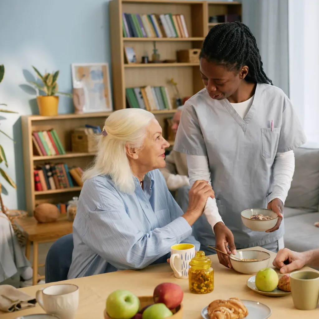 Home caregiver assisting an older adult with meal preparation through homemaking services in Columbus, OH.