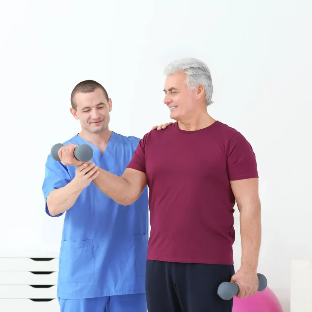 Physical therapist guiding an older adult through strength exercises during physical therapy in Columbus, OH.