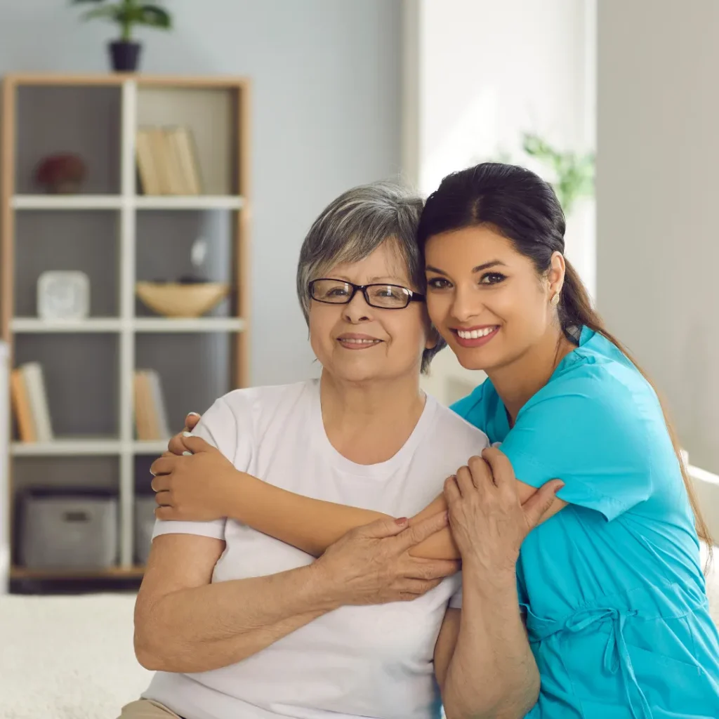 Caregiver assisting an older woman with respite care services at home in Columbus, OH.