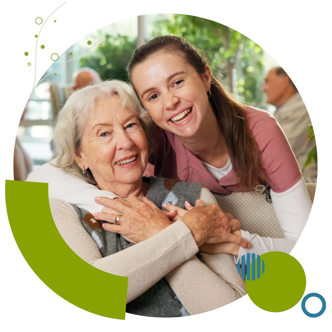 Professional caregiver providing respite care services to an older woman at home in Columbus, OH.