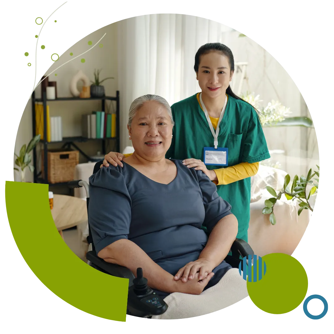 A compassionate caregiver provides supportive home care to an older woman using a wheelchair at home in Columbus, OH.