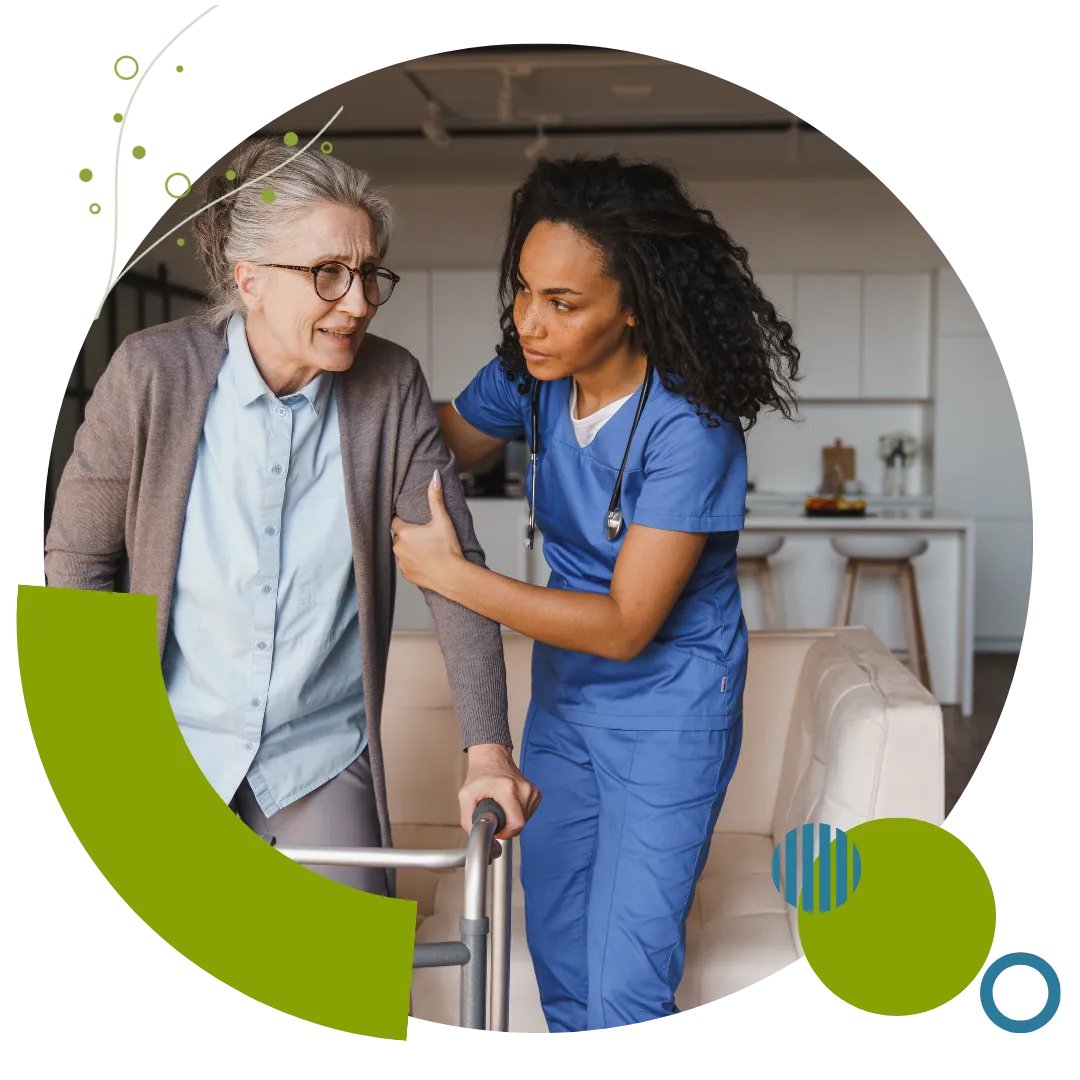 A professional nurse provides skilled nursing services and mobility support to an older woman at home in Columbus, OH.